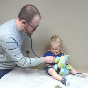 Doctor taking care of child at the office